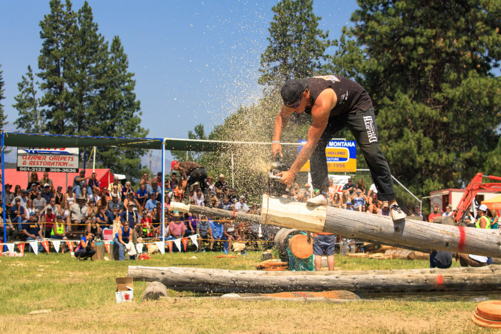 Darby logger days chainsaw contestants at darby logger days cutting wood in front of crowd